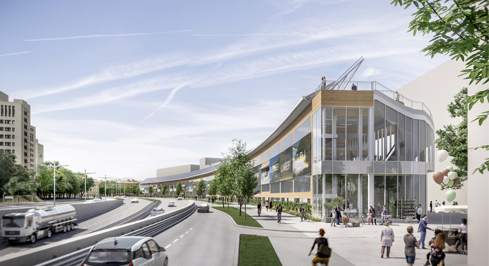 Auf den beiden Docks am Rand des „Village im Dritten“ bauen die Installateure eine hoch aufgeständerte Solaranlage auf. Sie schützt die Bewohner des Quartiers vor Lärm.